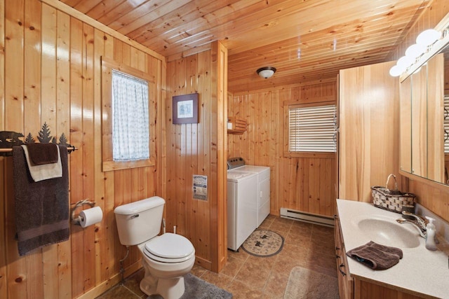 bathroom featuring vanity, wooden ceiling, washer and clothes dryer, and a baseboard radiator