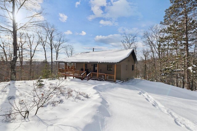 28255 Friendly Valley Rd, Washburn, WI 54891 - snow covered rear of property with a porch