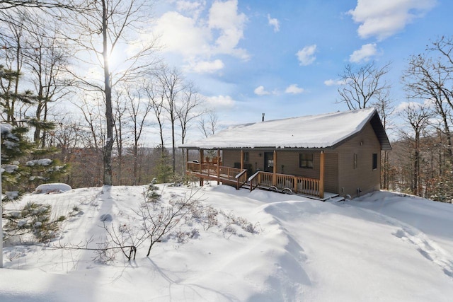 28255 Friendly Valley Rd, Washburn, WI 54891 - snow covered rear of property with a porch