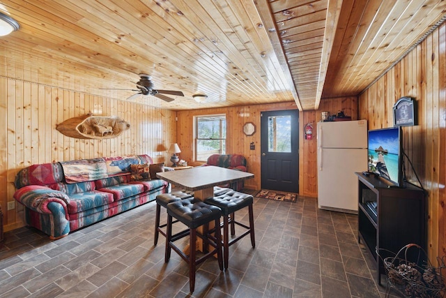 28255 Friendly Valley Rd, Washburn, WI 54891 - dining area with wood walls, wood ceiling, and a ceiling fan