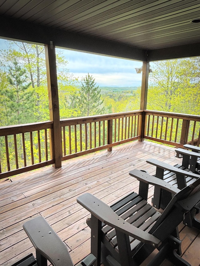 28255 Friendly Valley Rd, Washburn, WI 54891 - wooden terrace featuring a view of trees