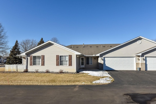 ranch-style home featuring a garage