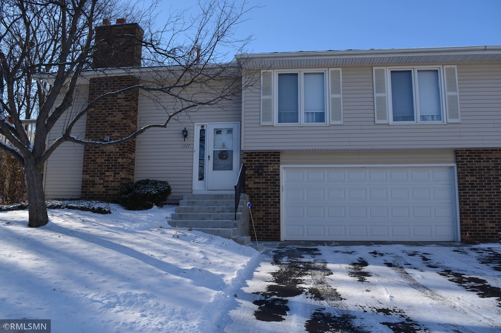 split foyer home featuring a garage