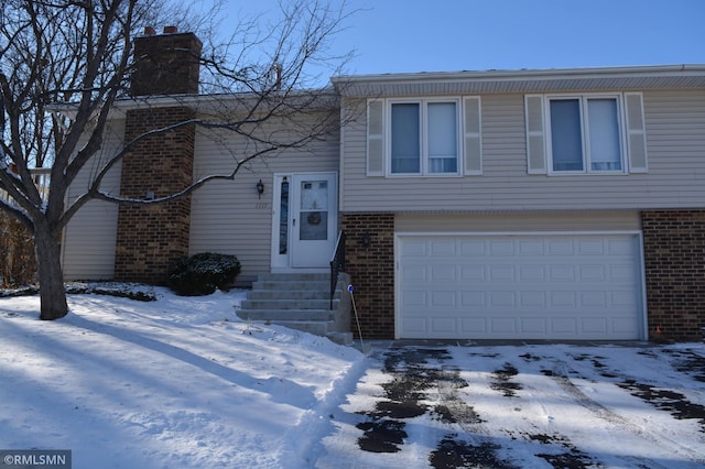 split foyer home featuring a garage