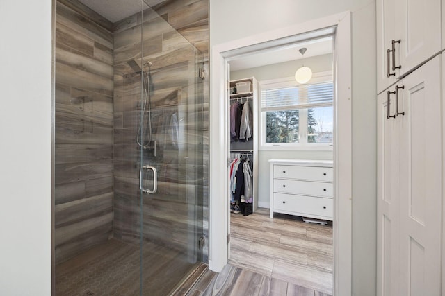 bathroom with a shower with shower door