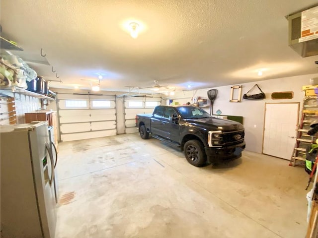 garage with stainless steel refrigerator