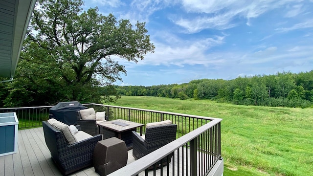 wooden terrace featuring outdoor lounge area, a yard, and grilling area