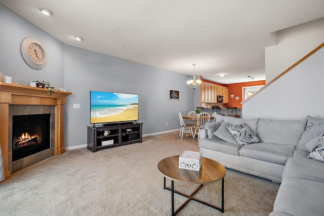 9668 Unity Ln N, Brooklyn Park, MN 55443 - carpeted living area featuring a chandelier, a fireplace, baseboards, and a textured ceiling