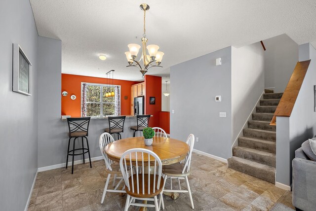 9668 Unity Ln N, Brooklyn Park, MN 55443 - dining room with stairway, a chandelier, a textured ceiling, and baseboards