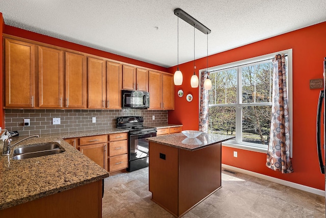9668 Unity Ln N, Brooklyn Park, MN 55443 - kitchen with black appliances, a sink, healthy amount of natural light, brown cabinetry, and a textured ceiling