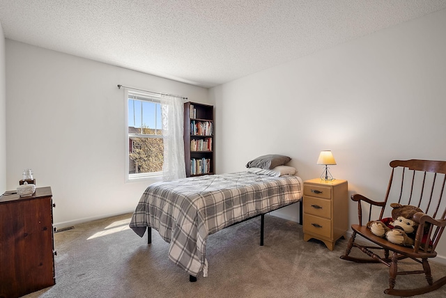 9668 Unity Ln N, Brooklyn Park, MN 55443 - carpeted bedroom with a textured ceiling and baseboards