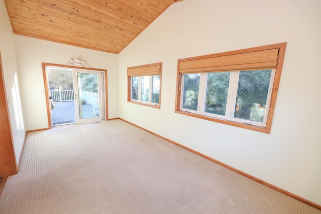 spare room featuring high vaulted ceiling, wooden ceiling, and carpet flooring