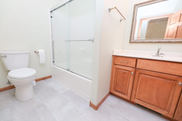 full bathroom featuring toilet, vanity, and enclosed tub / shower combo