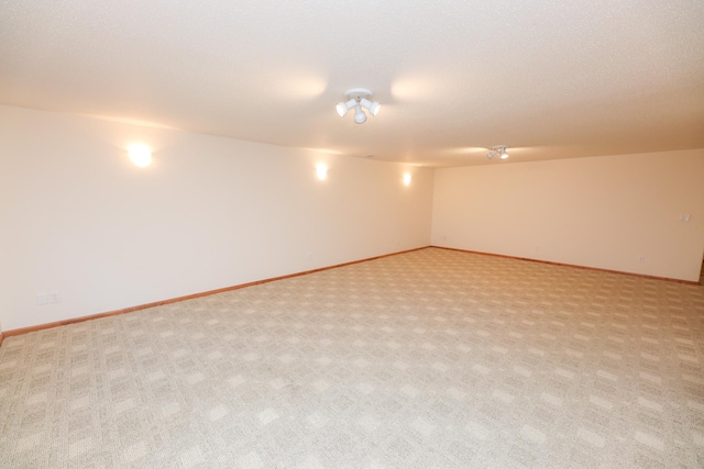 unfurnished room with light carpet