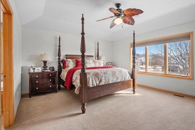 bedroom featuring ceiling fan and light carpet