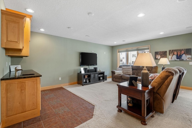 carpeted living room with a textured ceiling