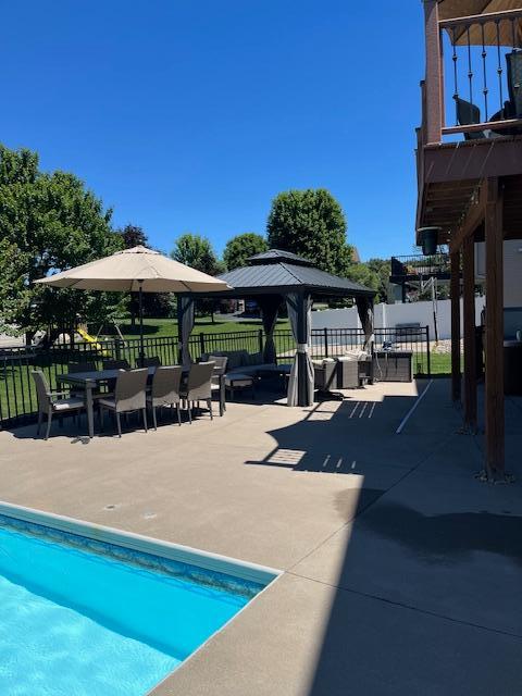 view of pool featuring a gazebo and a patio area