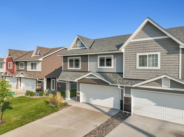 view of front facade with a garage and a front lawn