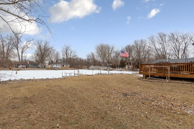 view of yard featuring a deck with water view