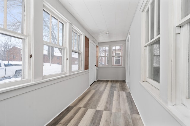 unfurnished sunroom with a wealth of natural light