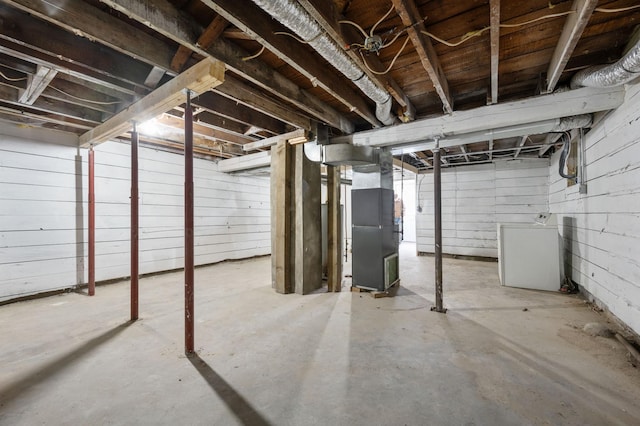 basement with washer / clothes dryer and heating unit