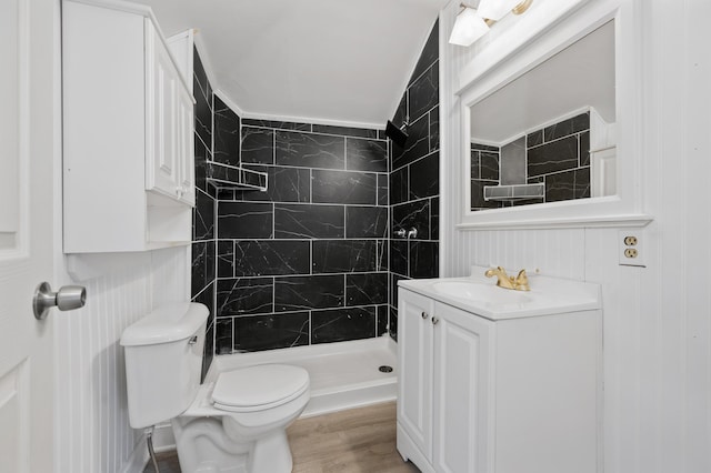 bathroom featuring toilet, walk in shower, vanity, and hardwood / wood-style flooring