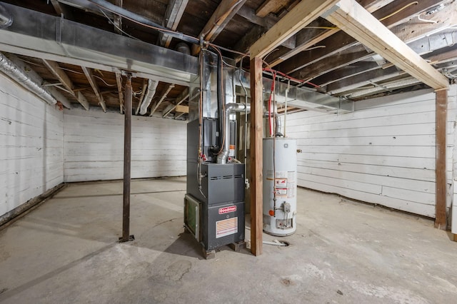 basement featuring heating unit and gas water heater