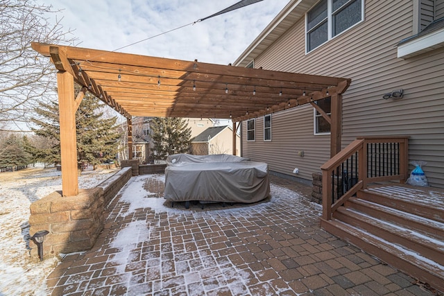 view of patio / terrace with a grill and a pergola