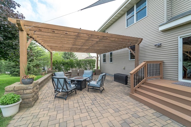 view of patio with a pergola and a fire pit