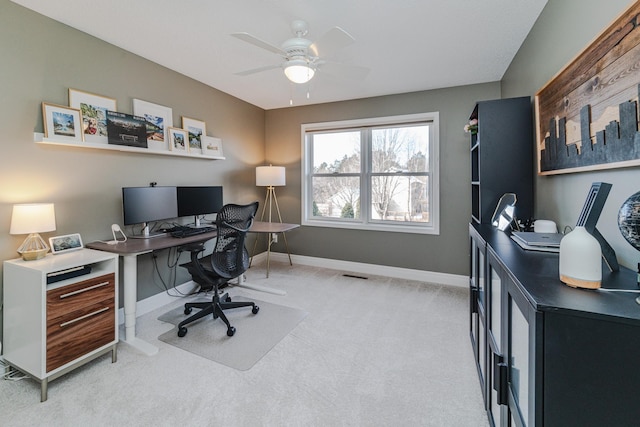 office featuring light carpet and ceiling fan