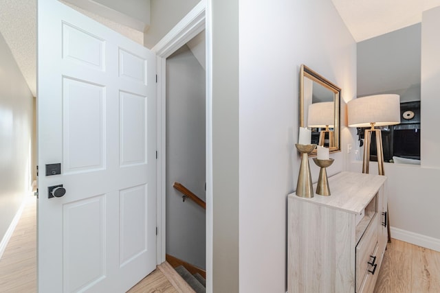 corridor featuring light hardwood / wood-style floors