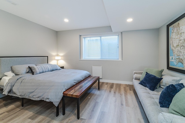 bedroom with light wood-type flooring