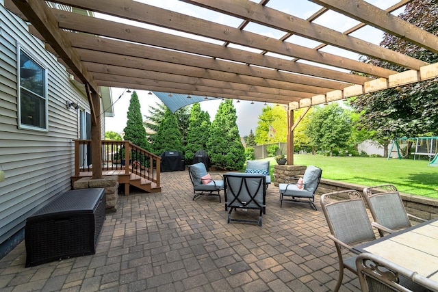 view of patio featuring a pergola and a playground