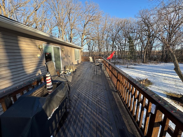 view of snow covered deck