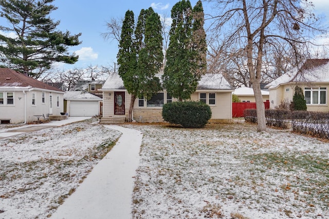 view of front of property featuring an outbuilding and a garage