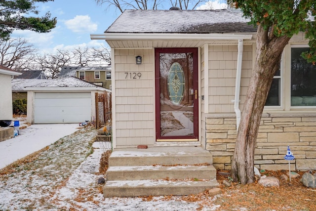 view of snow covered property entrance