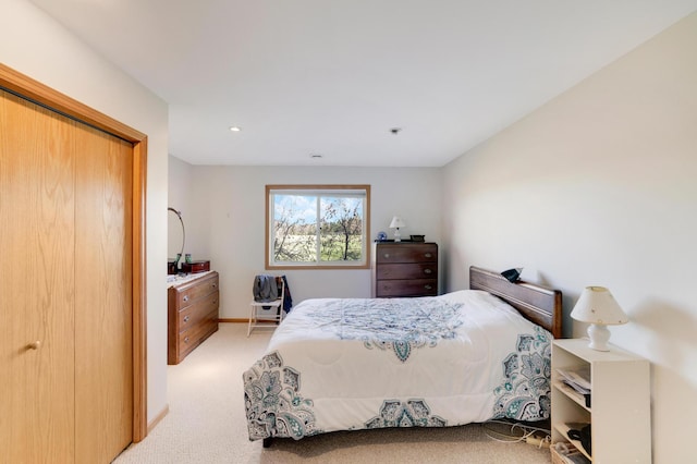 carpeted bedroom featuring a closet