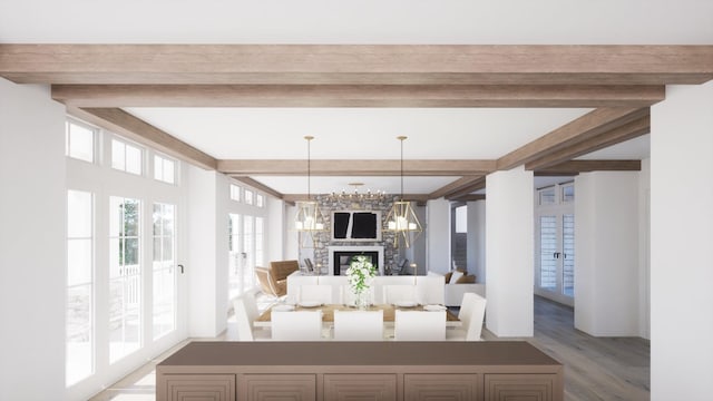 interior space featuring beamed ceiling, a notable chandelier, wood-type flooring, and a stone fireplace