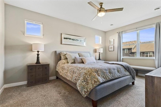 bedroom with ceiling fan and carpet floors