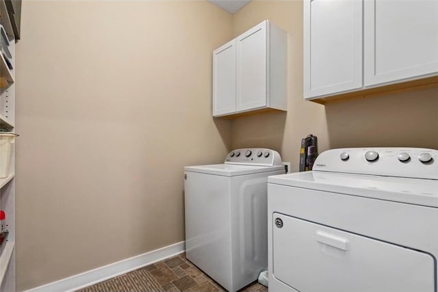 laundry room with cabinets and washer and dryer