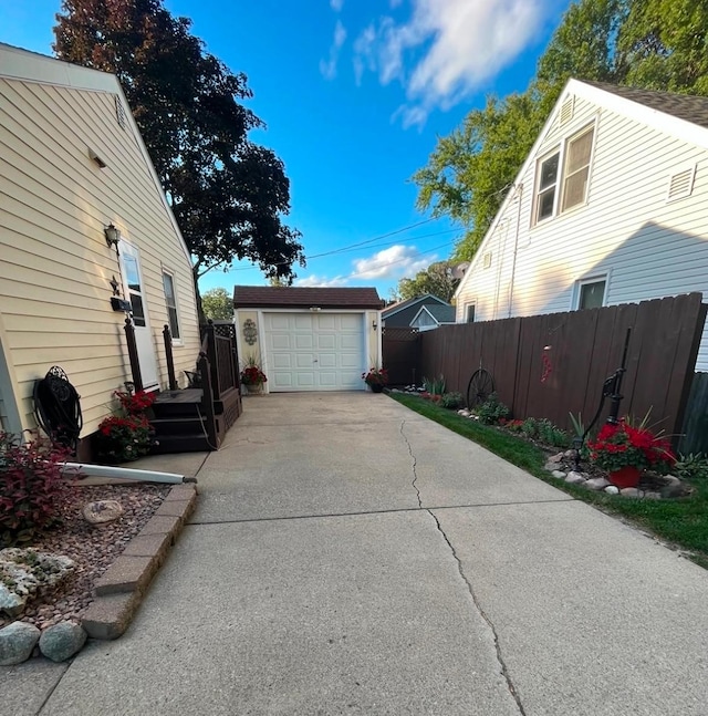 view of property exterior featuring a garage and an outbuilding