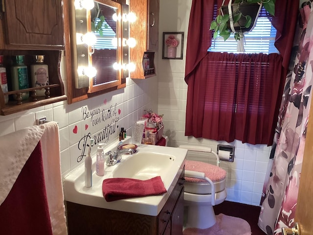 bathroom featuring decorative backsplash, tile walls, toilet, and vanity