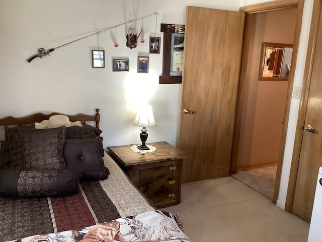 bedroom featuring light carpet