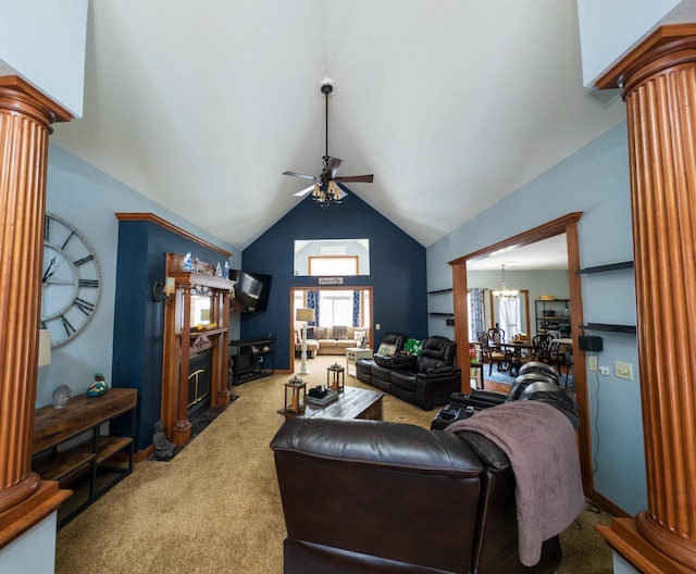 carpeted living room featuring vaulted ceiling, ceiling fan with notable chandelier, and decorative columns