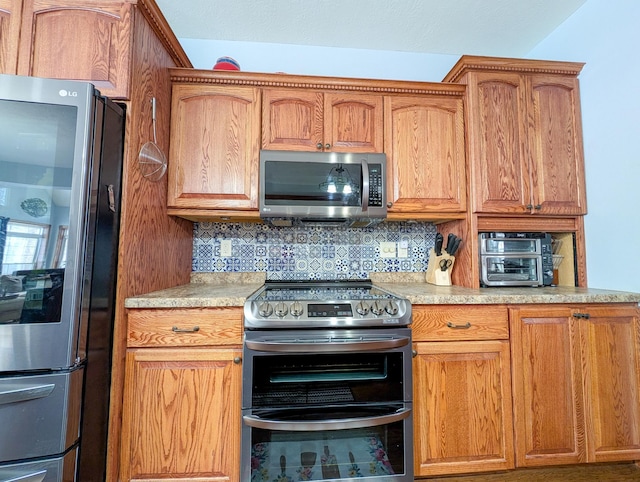 kitchen with backsplash and stainless steel appliances