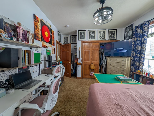 bedroom with carpet and a textured ceiling