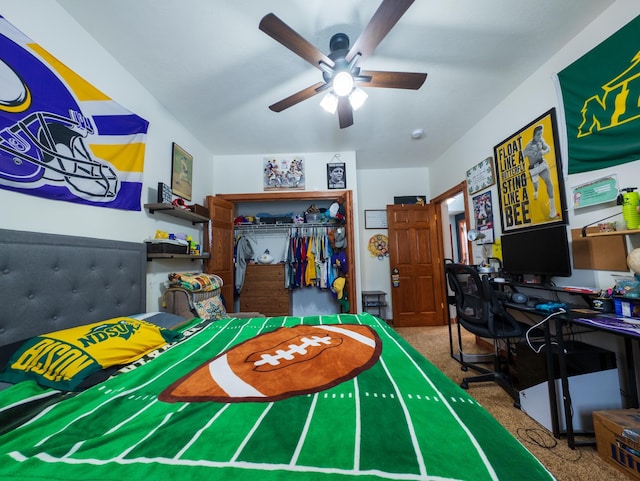 carpeted bedroom with ceiling fan and a closet