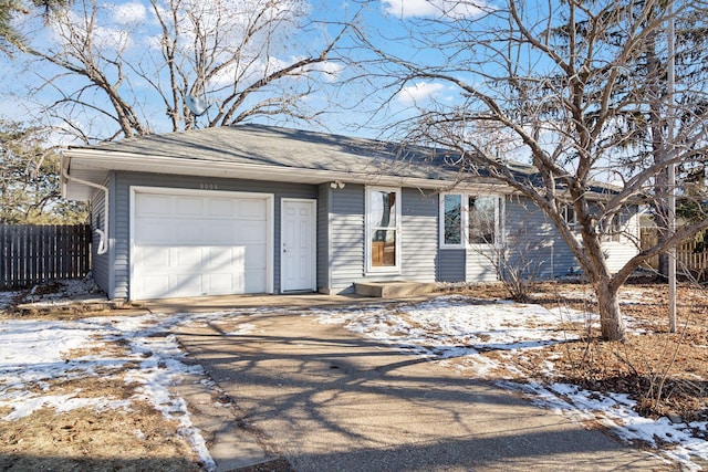 ranch-style house featuring a garage