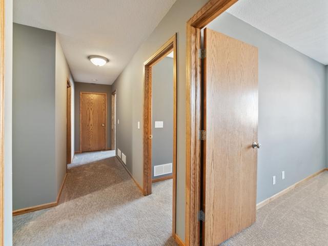 hallway with light carpet