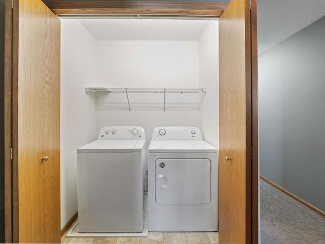 laundry room with separate washer and dryer